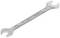 A silver spanner with two open ends of different sizes is lying on a white background.