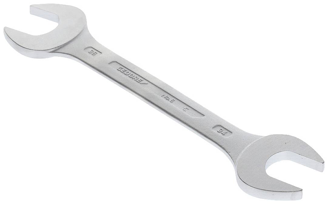 A silver double-ended spanner with differently sized openings at each end, used for tightening or loosening screws.