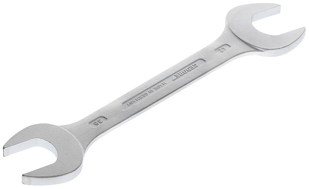 A silver double-ended spanner with open jaws, lying on a white surface.