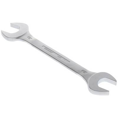 A silver spanner, double-sided, lies flat.