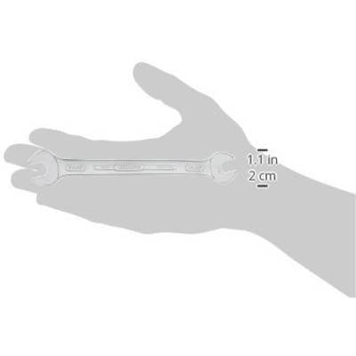 A spanner is held in one hand. A label indicates a length of 1.1 inches or 2 cm.