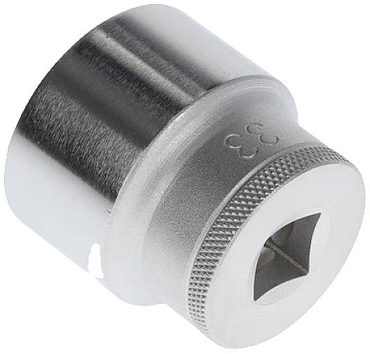 Silver-coloured castellated nut with 33 mm diameter, square hole for attachment to a suitable tool.
