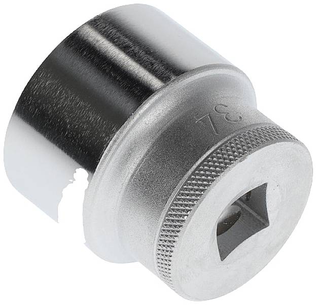 Metal screwdriver socket with knurled surface and hexagonal opening for screw connections.