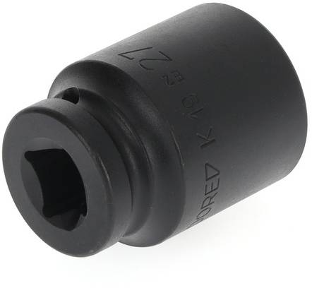 Black socket wrench attachment, cylindrically shaped, with smoothly polished surface and small inscription along the edge.