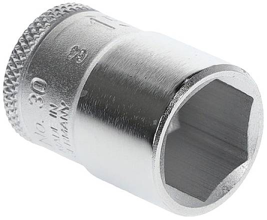 A silver-coloured socket attachment, cylindrically shaped, with a hexagonal opening. Used for tightening or loosening bolts.