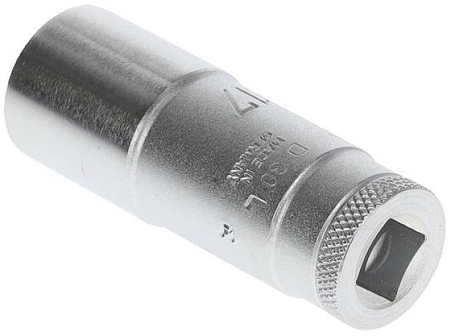 A silver pin badge, with '17' stamped on it, rests on a white surface.