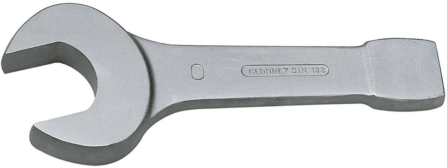 A silver spanner with an open jaw, suitable for mechanical work, lies on a white surface.