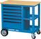 A blue workshop trolley with a wooden top, five drawers and an open compartment. It has two large wheels and two small support wheels.