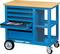 A blue workshop trolley with a wooden surface, four drawers, one open, displaying tools. Standing on wheels, labelled 'GEDORE 1502'.