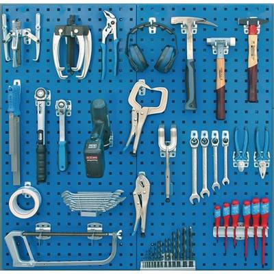 Tool wall with various hand tools such as hammers, spanners, pliers, screwdrivers and drills, neatly arranged.