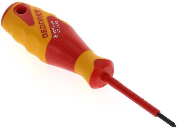 A red and yellow screwdriver with an ergonomic handle lies on a light surface.