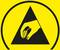 A yellow warning symbol with a black triangle and a hand pointing downwards signals caution regarding electrostatic discharge.
