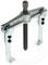 A three-legged puller, a tool for removing gears or bearings from shafts. Made of metal, with adjustable arms.