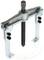 Two-legged metal puller, used for extracting bearings or gears in mechanical applications.