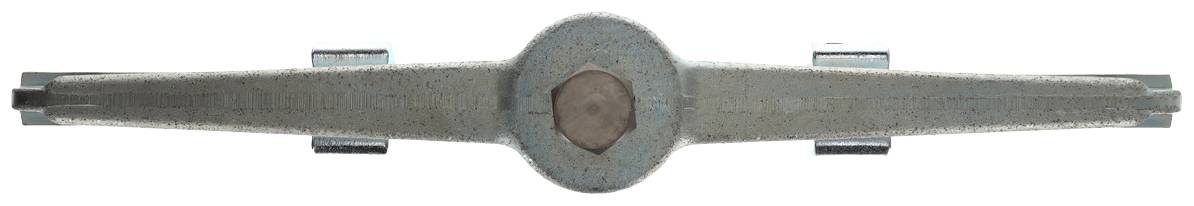 A rusty, metal spanner with a worn surface lies horizontally on a light background.