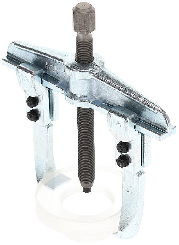 A metallic puller, consisting of two arms and a central screw, for removing hard-to-access parts.