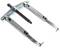 A two-armed metal puller is used to remove tightly fitted components, such as bearings or gears, from a shaft.