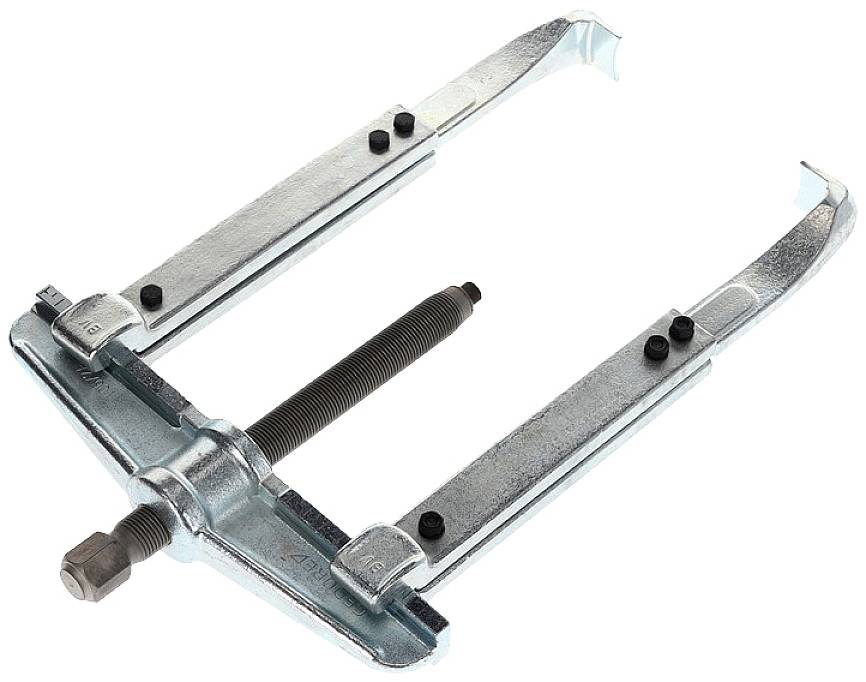 Two-armed metal puller with a central screw, used for removing tightly fitted parts such as gears or bearings.
