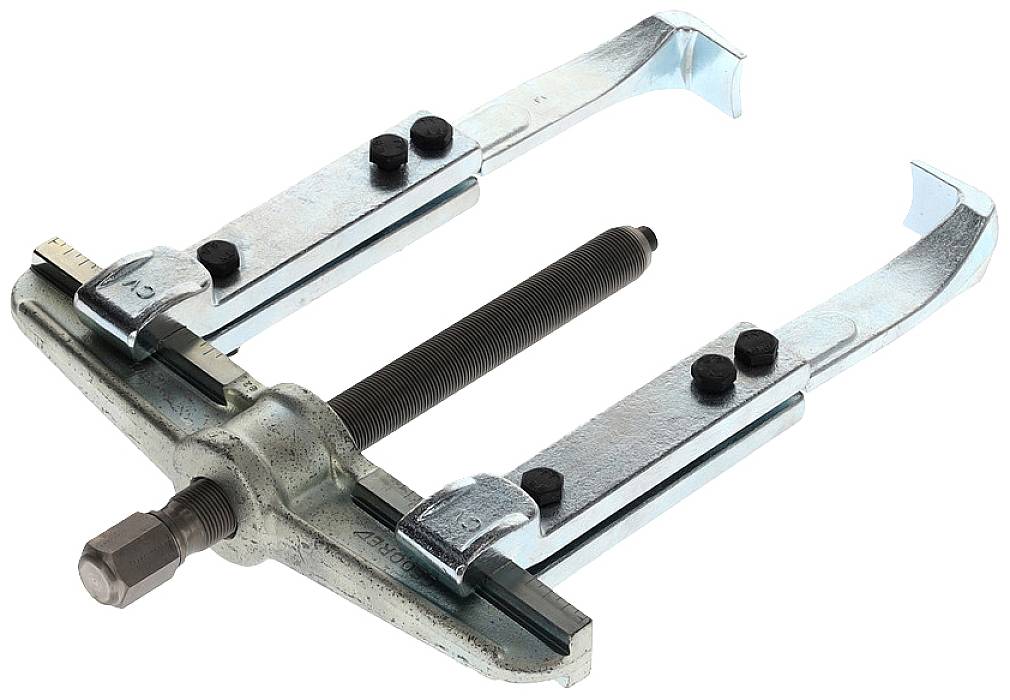 A two-armed metal puller with a central screw, used for removing tightly fitted parts from axles or shafts.