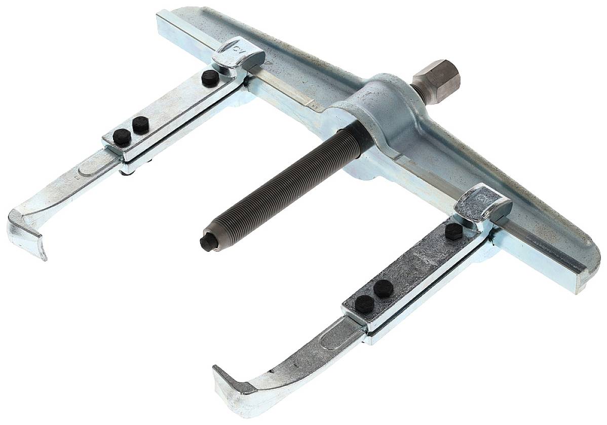 A three-legged puller, a metal tool with a screw mechanism for removing bearings or pulleys.