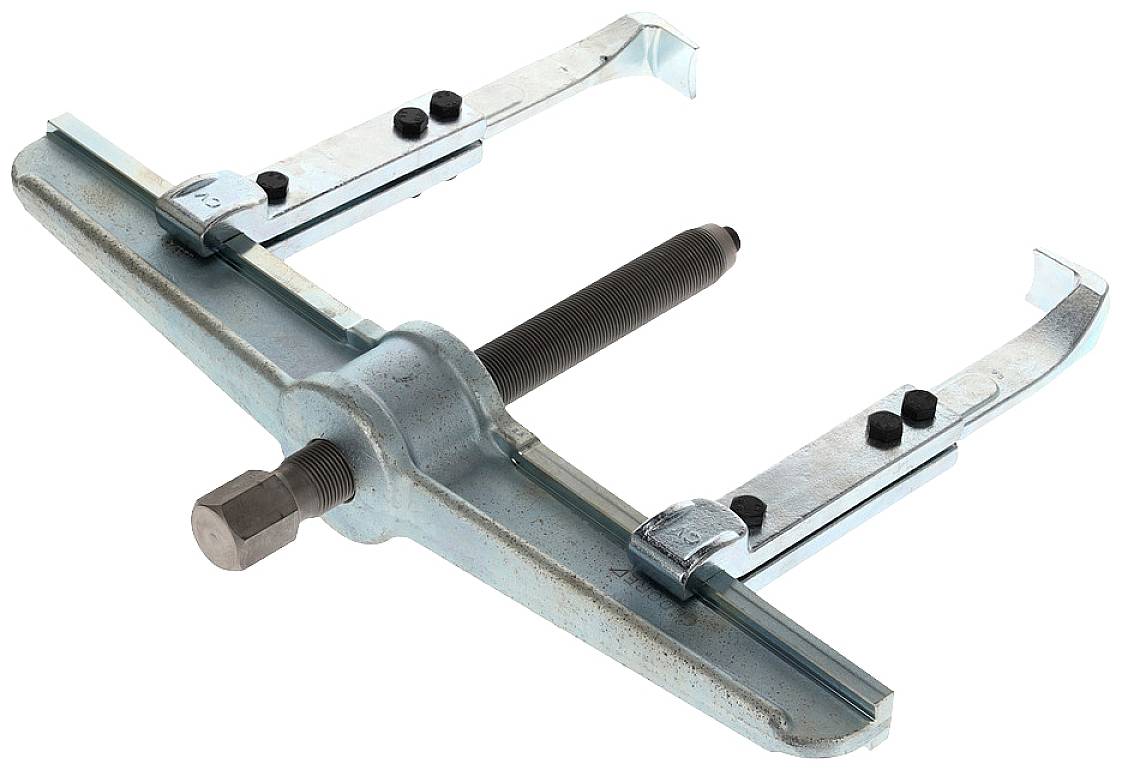 A blue puller with two adjustable arms, a central screw and nuts. The tool is used for removing bearings or gears.