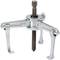Mechanical puller with three lifting arms and central screw, used for removing bearings or gears from shafts.