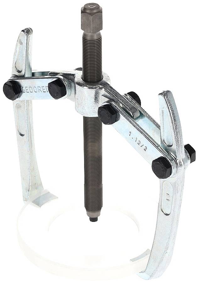 A three-legged metal puller, secured with multiple screws, is used for removing tightly fitted parts from a shaft.