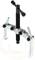 'A silver two-armed puller with a black handle, used to remove parts from a shaft.'