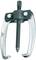 Two-legged puller. Tool for removing stuck parts from shafts, e.g. bearings or gears. Made of metal with a screw mechanism.