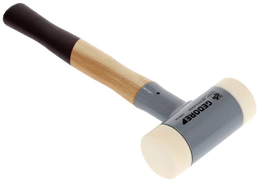 Rubber mallet with a wooden handle and two white plastic striking faces. Used for delicate work to avoid damaging surfaces.
