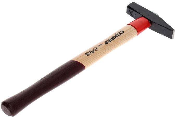 A hammer with a red neck and black head, wooden handle with a brand logo. A tool for fastening or processing materials.