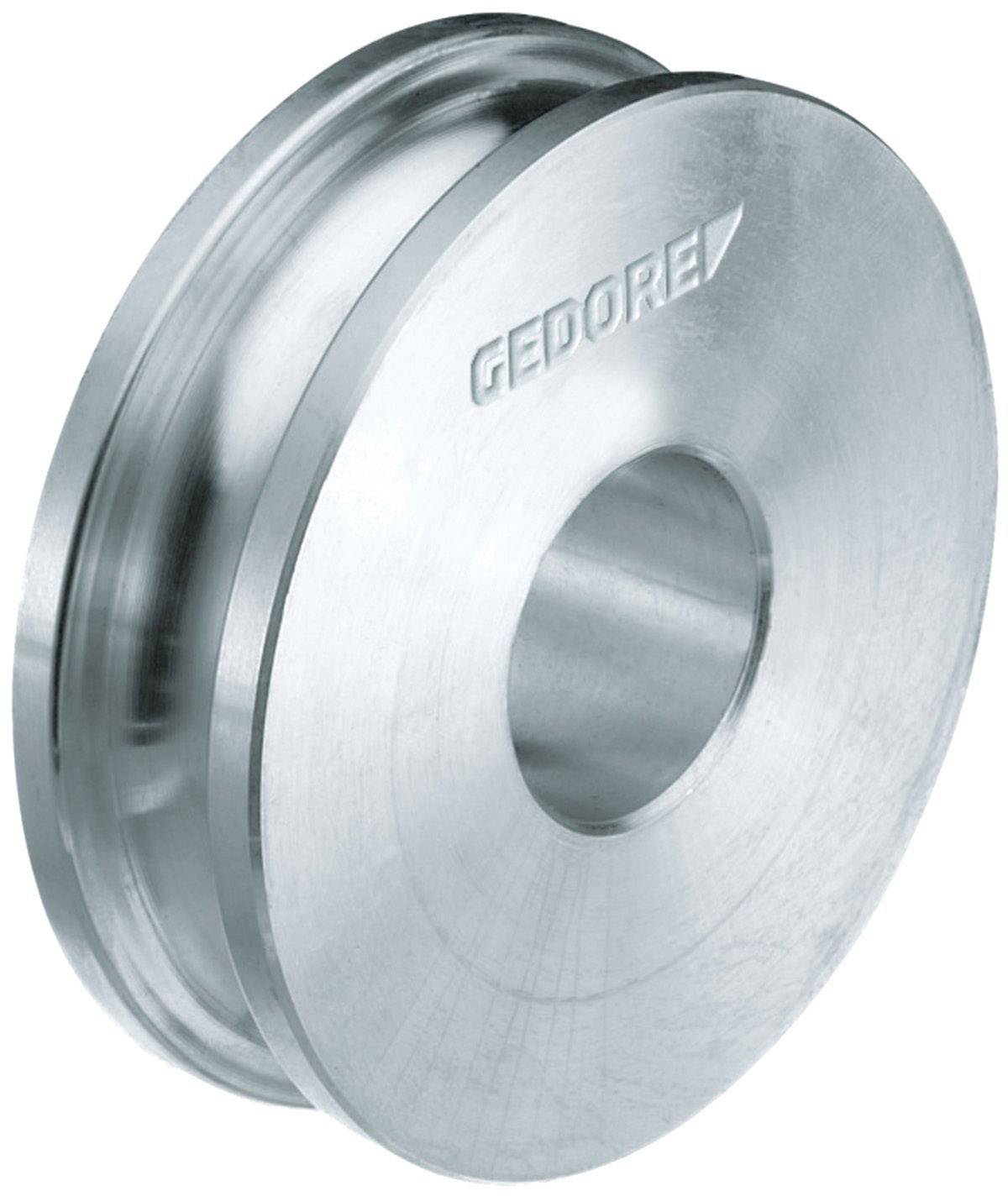 A metallic gear wheel with the 'GEDORE' engraving, used in a technical environment, demonstrates precise engineering design.