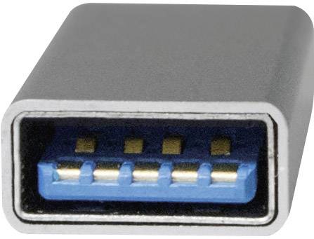 Close-up of a USB-C connector with visible gold contacts and blue interior, used for data transfer and power supply.