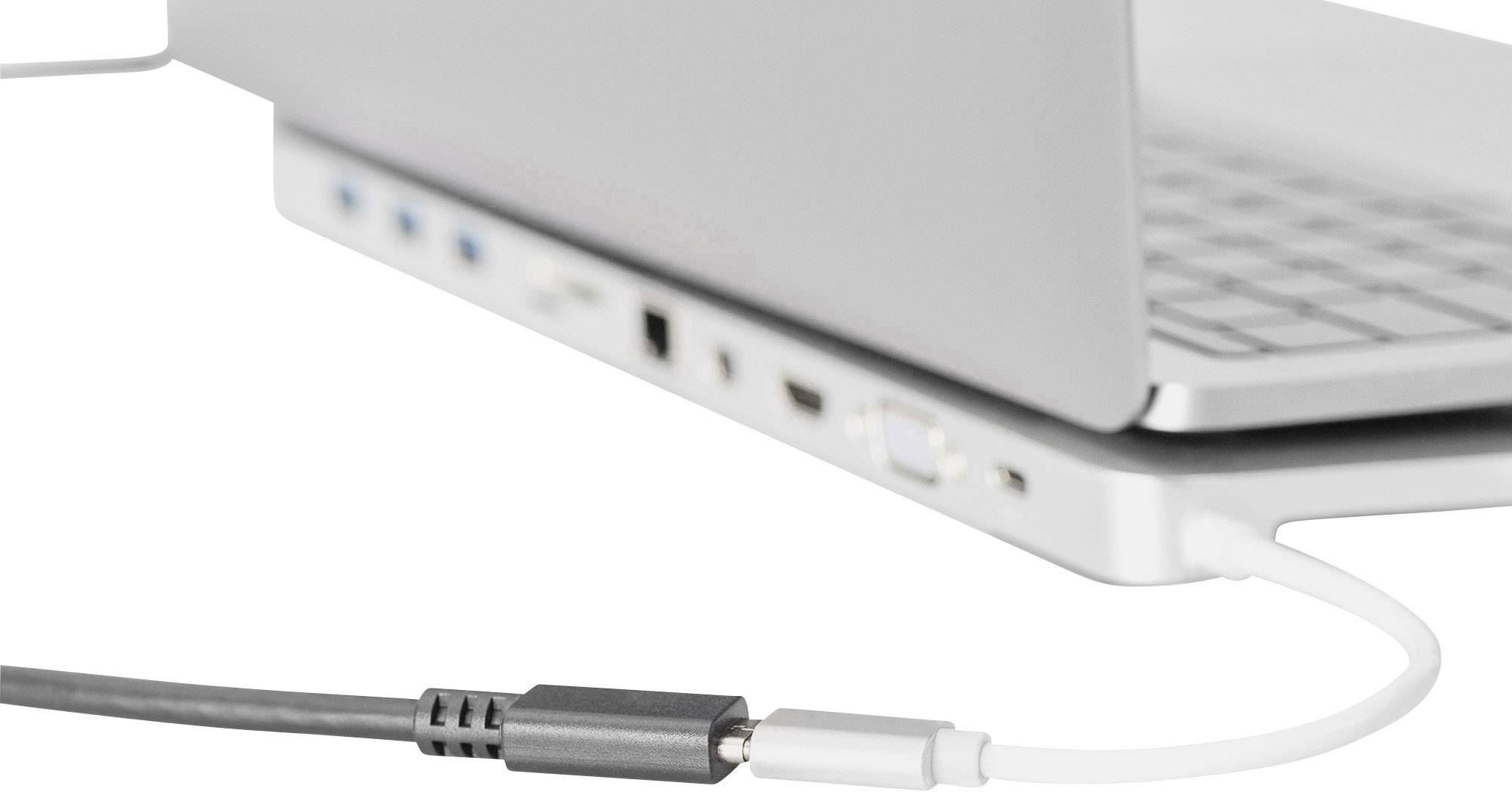 A laptop with multiple ports on the side, including USB and HDMI. A white cable is plugged in, likely for charging.