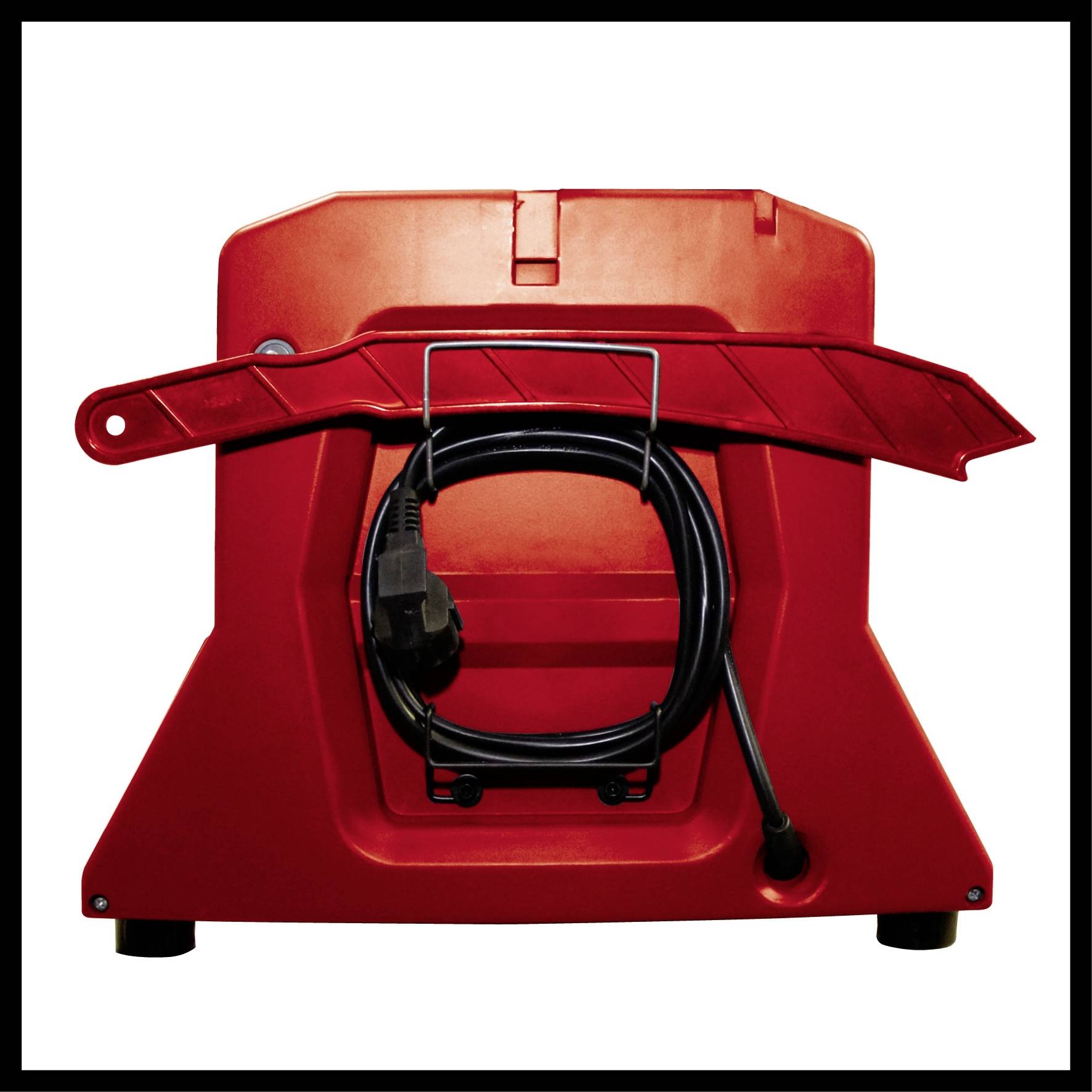 Red plastic box with a black power cable wound at the front. The box stands on small feet.