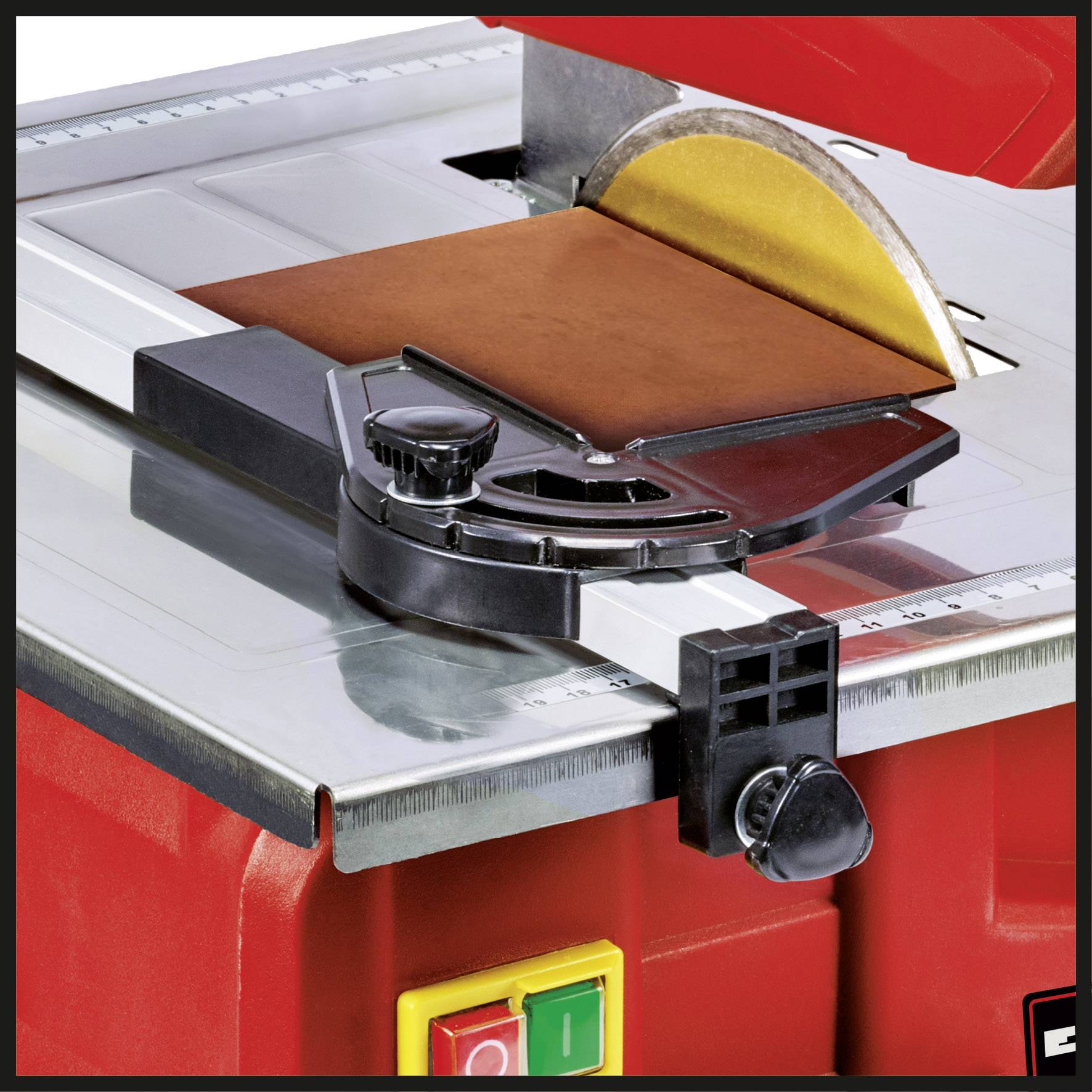 A red tile cutter with a yellow circular saw blade. A black guide carriage with an angle gauge is attached to it.