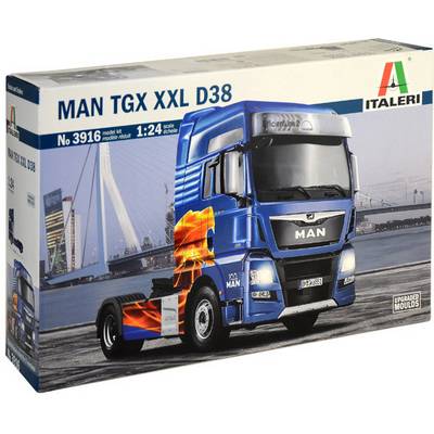 'MAN TGX XXL D38 model kit by Italeri, scale 1:24. Contains parts for assembling a truck model. Pictured with city bridge in the background.'