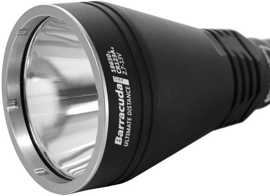 Black torch with a silver reflector and the inscription 'Barracuda Ultimate Distance, 18650/21700'. Main focus is on the reflector.