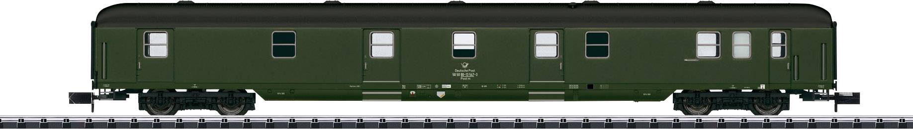 A green historical railway carriage on a track. The carriage has multiple windows and a classic, unadorned design.