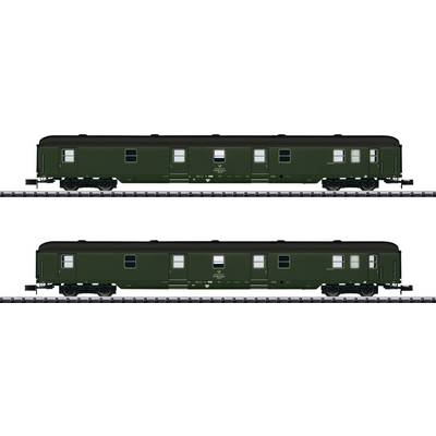 Two green railway carriages on parallel tracks. Both carriages have windows and doors and are positioned side by side on the rails.