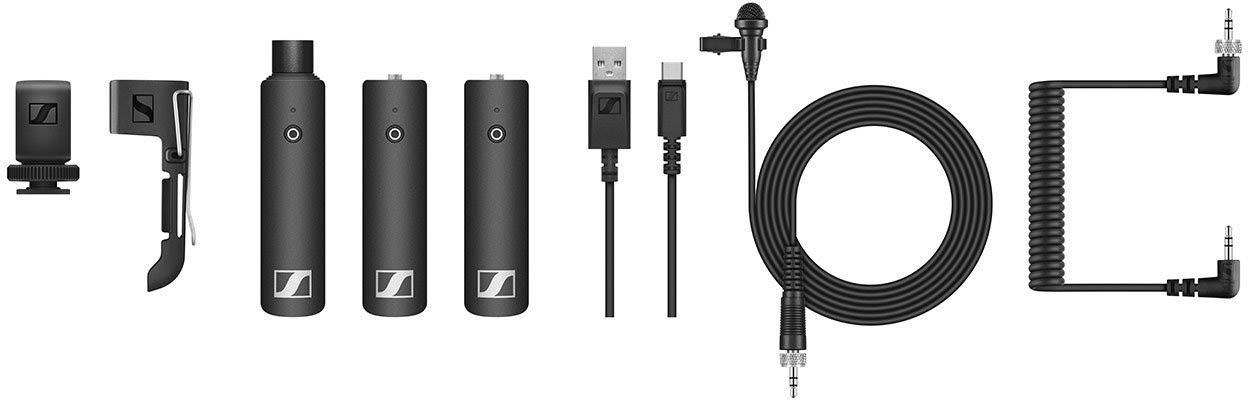 Several audio devices and cables, including a microphone with accessories, three audio transmitters, USB cables, and audio cables.