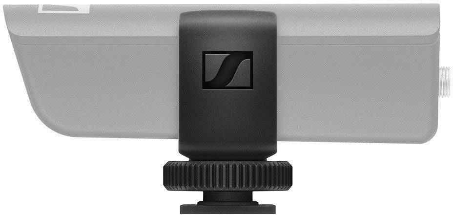 Side view of a microphone with a black mounting clip, the logo on the clip is visible.