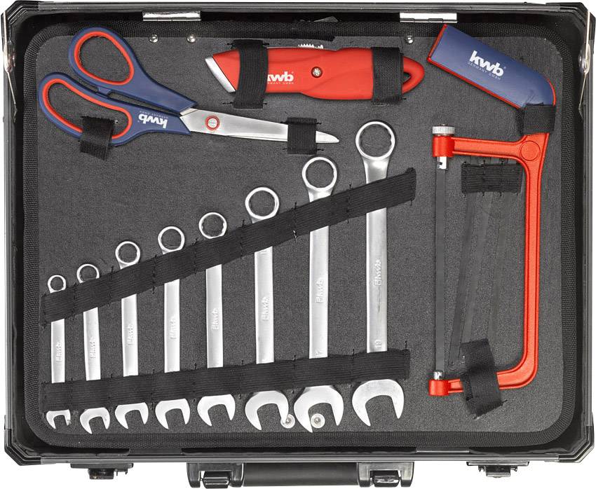 An open toolbox reveals a row of combination spanners, scissors, a craft knife, and a hacksaw.