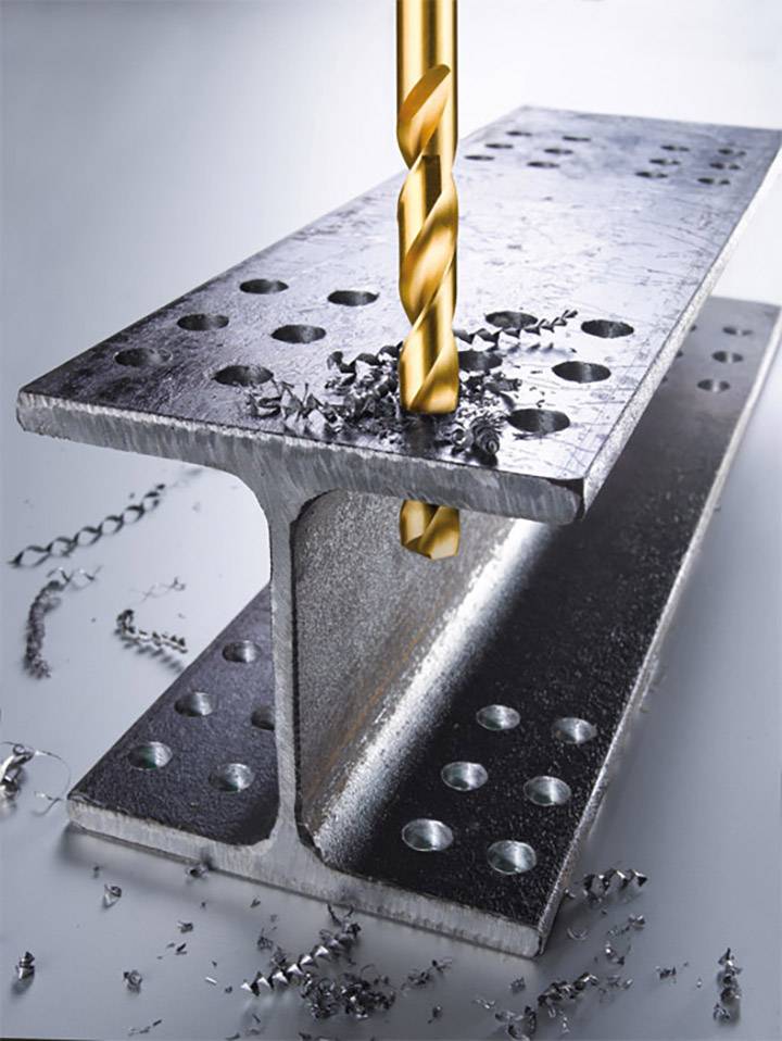 A golden drill penetrates a steel beam, surrounded by metal shavings. The image demonstrates precision drilling in metal.