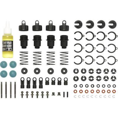 Various components of a shock absorber set, including springs, bolts and oil cap, symmetrically arranged for model building.