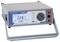 Digital multimeter with display reading '228.1 V', various measurement options and connections. Device for precise voltage measurement.