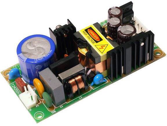 An electronic circuit with components such as capacitors, inductors and heatsinks on a circuit board, crucial for power supply.