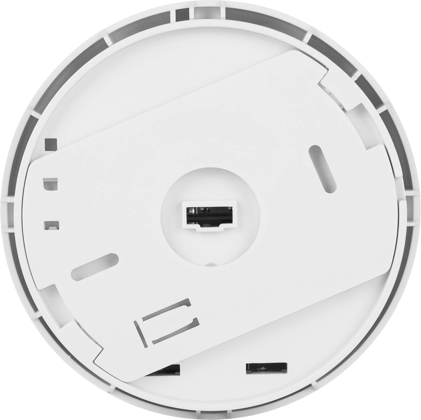 A circular smoke detector shown from below, with visible battery compartment and mounting options.