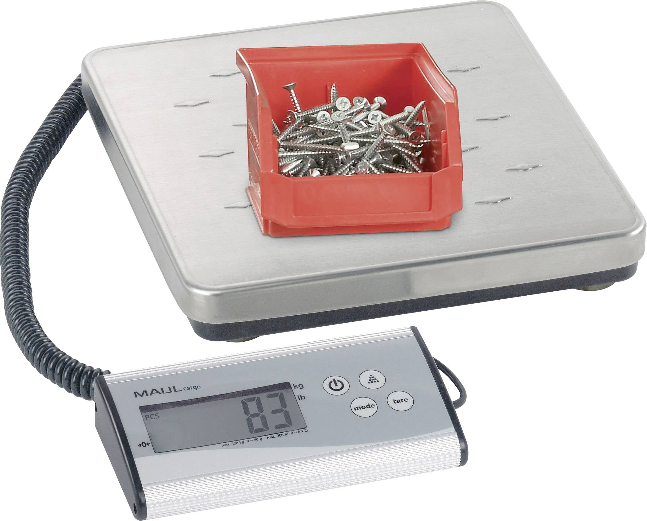A scales shows '83' grams, with metal screws lying in a red container.