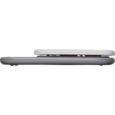 The image shows a side view of a folded laptop with a grey underside and light-coloured top.